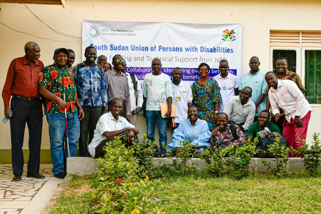 Photo above shows participants of Stakeholders Quarterly Meeting With the South Sudan Union Of Persons With Disabilities standing together posing for a photograph