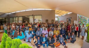 A big group of attendees standing together posing for a picture.