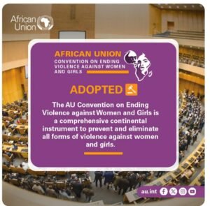 A graphic announcement from the African Union about the adoption of the Convention on Ending Violence Against Women and Girls. The background features a large conference hall filled with delegates. The foreground contains a purple text box with bold yellow and white text stating 'African Union Convention on Ending Violence Against Women and Girls – ADOPTED'. The message describes the convention as a comprehensive continental instrument to prevent and eliminate violence against women and girls. Social media icons and the AU website (au.int) are visible at the bottom.