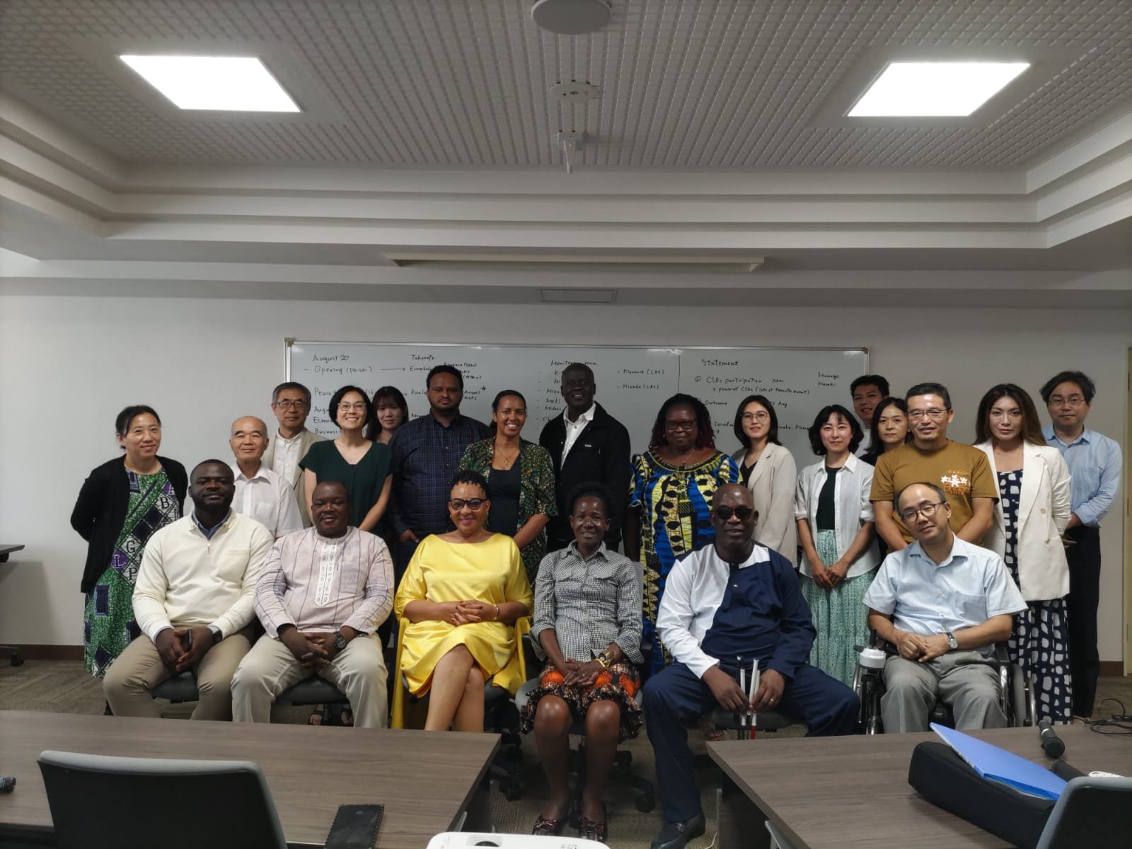 Group photo - ADF Executive Committee Treasurer, Mr. Ayassou Germain, with other participants after the CSO wrap-up meeting