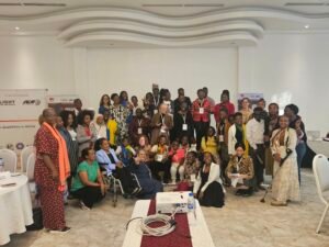 Young leaders with disabilities and facilitators gather joyfully during the Youth Leadership Programme contact workshop in Addis Ababa, smiling, raising hands, and celebrating their shared leadership journey