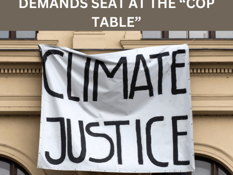 Heading that reads: Global disability movement demands seat at the “COP table”, underneath a picture shows a banner hanging that reads: Climate Justice