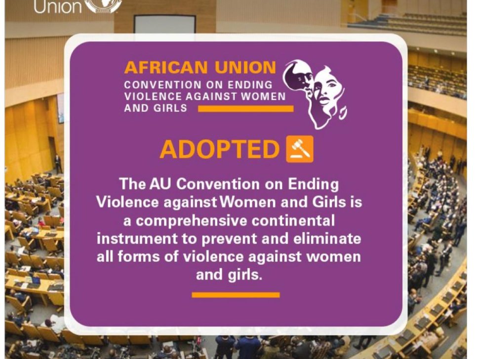 A graphic announcement from the African Union about the adoption of the Convention on Ending Violence Against Women and Girls. The background features a large conference hall filled with delegates. The foreground contains a purple text box with bold yellow and white text stating 'African Union Convention on Ending Violence Against Women and Girls – ADOPTED'. The message describes the convention as a comprehensive continental instrument to prevent and eliminate violence against women and girls. Social media icons and the AU website (au.int) are visible at the bottom.